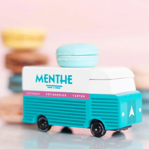 Candylab wooden toy Menthe Macaron van with macaron piled in the background | Conscious Craft