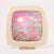 Decorative lamp with a fairy tale design featuring a girl, red fox, and owl against a pink sky.