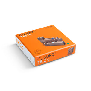 Closed orange box containing the wooden marble run Cuboro TRICK Extra Set | Conscious Craft