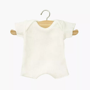 White baby romper on a wooden hanger against a white background