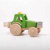 Dynamiko green wooden Tractor with ballast and bucket | Image © Conscious Craft