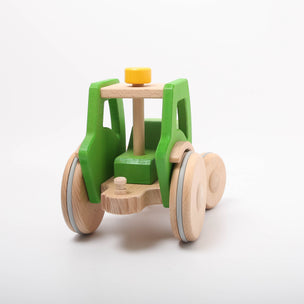Dynamiko green wooden Tractor | Image © Conscious Craft