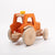 Dynamiko wooden orange tractor | Image © Conscious Craft