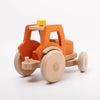 Dynamiko wooden orange tractor | Image © Conscious Craft