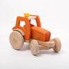 Dynamiko wooden orange tractor | Image © Conscious Craft