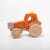 Dynamiko wooden ballast on orange Tractor at front | Image © Conscious Craft