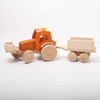Dynamiko orange wooden Tractor with trailer & bucket on the front | Image © Conscious Craft