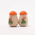 Erzi Wooden salt and pepper shakers with orange lids on a white background