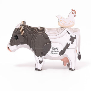 paper Frisian cow with chicken on its back