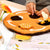 Children's play mat with bee and flower design on a table