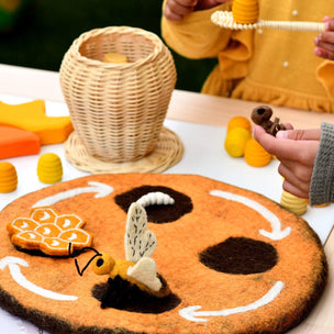 child holding felted bee
