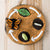 Life cycle of a butterfly felt board on a wooden surface
