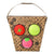 Oli & Carol Sanitary Balls in a brown patterned storage box with a carrying handle, featuring three colorful balls: a red tomato-shaped ball, a lime-green cabbage-shaped ball, and a pink avocado-shaped ball.