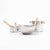 Set of stainless steel cookware with wooden handles on a white background