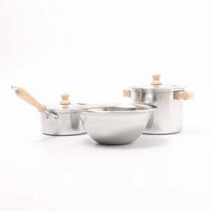 Set of stainless steel cookware with wooden handles on a white background