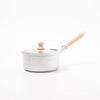 Small saucepan with wooden handle and lid knob on a white background