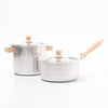 Two stainless steel cookware pots with wooden handles on a white background