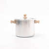 Stainless steel pot with wooden handles on a white background