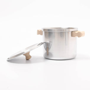 Silver pot with wooden handles on a white background