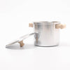 Silver pot with wooden handles on a white background