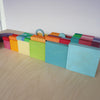 Grimm's Concentric Circles & Rings Pastel with Large stepped Pyramid blocks and stacking boxes.