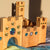 Wooden castle toy with colorful gemstones on a soft surface