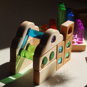 Colorful toy structure with interlocking pieces on a white surface