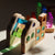 Colorful toy structure with interlocking pieces on a white surface
