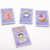 Set of tarot cards with colorful illustrations and a guidebook on a white background