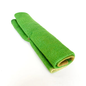 Rolled-up green fabric on a white background