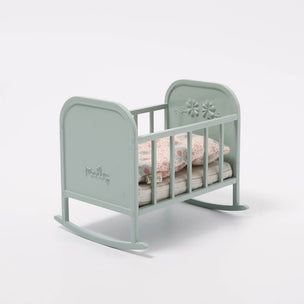 Maileg Mint green baby crib with floral design on a white background