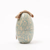 Decorative Maileg egg-shaped container with floral pattern and ribbon on a white background