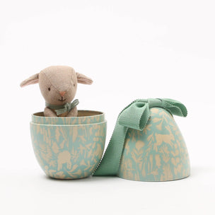 Maileg lamb toy inside a decorative Egg with a matching lid on a white background