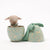 Maileg lamb toy inside a decorative Egg with a matching lid on a white background