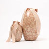 Two decorative Maileg egg-shaped containers with floral patterns and ribbons on a white background