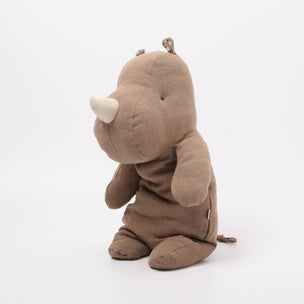 Brown Maileg plush toy rhino on a white background