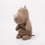 Brown Maileg plush toy rhino on a white background