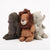 Three Maileg plush toys, including a lion, a gorilla and a elephant, on a white background