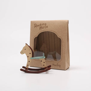 Wooden rocking horse toy next to its packaging on a white background