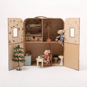 Miniature Maileg SuitCasa dollhouse with furniture and toy mice inside a cardboard box