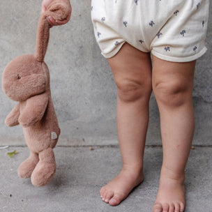 Child holding maileg plush bunny