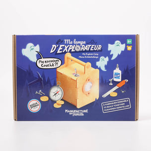 Box for a children's explorer lamp set with wooden components and ghost illustrations on a blue background.