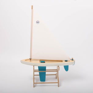 Small sailboat model on a white background