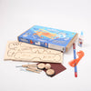 Wooden toy kit with components and packaging on a white background