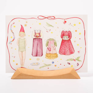 Postcard of a girl doll and outfits