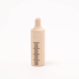 Wooden bottle with a comb on a white background