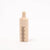 Wooden bottle with a comb on a white background