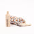 Baby bottle, comb, and brush set with floral pattern on a white background