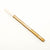 Gold-colored cosmetic pencil with 'L'ANIME' branding on a white background