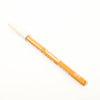 Orange eyeliner pencil with white cap on a white background